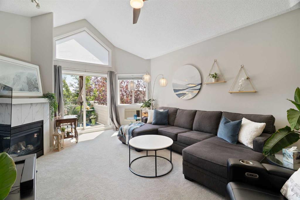 Living room with fireplace and large windows
